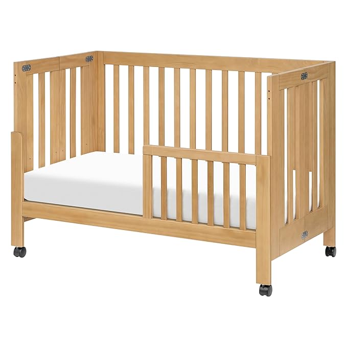 babyletto Maki 2-in-1 Portable Folding Crib with Toddler Bed Conversion Kit in Honey, Greenguard Gold Certified